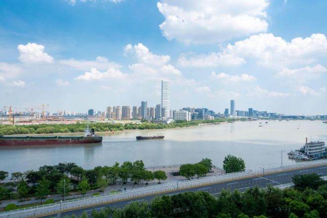 Shanghai Bay Phase 3, a luxury residence in Xuhui Riverfront area, featuring a view of the river.