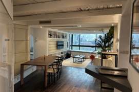 “Stylishly renovated apartment with large windows and Suzhou Creek views