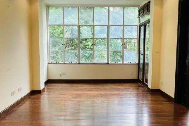 Absolutely stunning apartment, with three bedrooms, and windows offering views of greenery.
