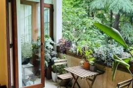 Absolutely stunning apartment, with three bedrooms, and windows offering views of greenery.