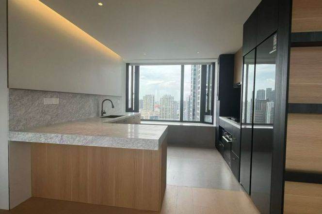 Top-floor duplex on Suzhou River, with a private large terrace and a high-ceilinged living room.