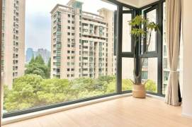 The Suzhou River, with green plants visible from the windows, and large floor-to-ceiling balconies